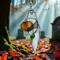 Ghost with Pumpkin stained glass suncatcher. Made of white and  orange glass with lamp worked glass leave accent.