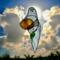 Ghost with Pumpkin stained glass suncatcher. Made of white and  orange glass with lamp worked glass leave accent.
