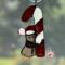 Christmas Mouse stained glass suncatcher. Made with gray, pink, white and red glass. Crystal eyes, nose and hat pom-pom.
