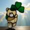 Saint Pat's Bear stained glass suncatcher in cream glass with dark green shamrock.