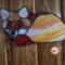 Fox Stained Glass Suncatcher by Robin C. Hary made in shades of red, orange, yellow, cream, and white glass. Hanging on a wall to show difference in glass with lighting.