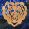 A handmade wooden Victorian-style fretwork floral heart Christmas tree ornament, featuring intricate cutout floral patterns in a heart shape, with a warm natural wood finish.