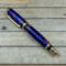 Royal purple resin pen with pinecones