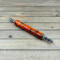 Large ergonomic seam ripper in orange and black resin
