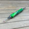 Bright lime green seam ripper with large ergonomic grip