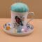 This is an example of what bobbins would look like on the saucer. They are not included with this item.