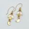 Handmade celestial earrings with glass crescent beads and gold moon dangles on 14k gold-filled wires.