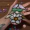 Girl Springtime Gnome stained glass suncatcher by Robin C. Hary being held for size reference.