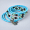 This handmade bracelet is made of turqoise blue seed beads as well as green and black beads.  I have added a butterfly charm.