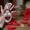 Valentine's Day Gnome "Romeo" stained glass suncatcher- by Robin C. Hary- being held for size reference.