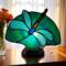 Dragonfly Stained Glass Fan Lamp by Robin C. Hary shown with white wings and green background.