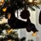 Dachshund Stained Glass Ornament by Robin C. Hary- Black and Tan shown hanging on a Christmas tree.