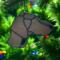 Weimaraner Stained Glass Ornament by Robin C. Hary shown hanging on a Christmas tree.