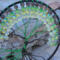6 inch black yarn wrapped hoop cradles black and green wire tree of life, adorned with black and shades of green frosted glass beads. 