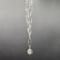 Handmade necklace with silver plated pendant set with North Star cubic zirconia on rhodium chain and hook front clasp.