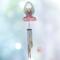 Angel stained glass wind chime- pink dress with blonde hair and white wings. Metal chimes hang down about 20" below the angel.