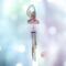 Angel stained glass wind chime- pink dress with blonde hair and white wings. Metal chimes hang down about 20" below the angel.