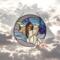 Angel on the Crescent Moon stained glass panel, a pale purple moon with purple blue sky and light blue/white clouds- the angel is dressed in a white dress, wings are made of iridescent and clear glass, her hair is rich brown color and falls to her waist. Skin color is fair.