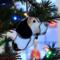 Beagle stained glass ornament hanging on a Christmas tree.