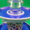 A close up of the candleholder and the pearls.
