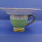 Looking straight at it, you can see the pearls around the base of the cup and the pearl flower peeking over the saucer. 