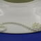 This is a close up of the flower and scroll, covering up the small chips.