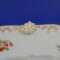 This is the closeup of the pearl flower. You can also see the gold trim around the saucer.