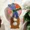 Dragonfly Stained Glass Night Light- in green and blue iridescent glass with yellow, orange mottle glass backdrop.