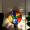 Dragonfly Stained Glass Night Light- in green and blue iridescent glass with yellow, orange mottle glass backdrop. Shown lite.
