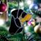 Rottweiler stained glass ornament by Robin C. Hary hanging on a Christmas Tree.