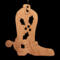 Handmade wooden Christmas tree ornament shaped like a cowboy boot, featuring a sprig of holly On the side of the boot, and round berry accents.