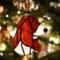 Basset Hound stained glass ornament in Red and White- shown hanging on a Christmas Tree.