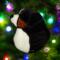 Bernese Mountain Dog stained glass ornament shown hanging on a Christmas tree.