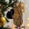 Boxer stained glass ornament- Fawn cropped ears- shown hanging on a Christmas tree.