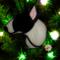 Bull Terrier stained glass ornament- shown in Black and White hanging on a Christmas tree.