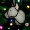 Bull Terrier stained glass ornament- shown in White hanging on a Christmas tree.