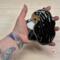 Cavalier King Charles Spaniel stained glass ornament shown in Tricolor being held for size reference. Approx. 4" by 5".