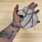 Great Pyrenees stained glass ornament being held for size reference. Approx. 5" x 5".