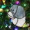 Shih Tzu stained glass ornament in Blue (gray) hanging on a Christmas tree.