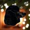 Large Poodle stained glass ornament- in Black- hanging on a Christmas tree.