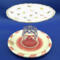 This lollypop jewelry dish has a dark pink and white dish on the bottom with pearls surrounding the crystal goblet.