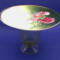The flowers in the dish are a nice variety of pink. The dish is roughly 5 inches high by 7 inches wide.
