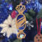 A handcrafted wooden Christmas tree ornament shaped like a wrapped candy, featuring intricate Victorian fretwork with twisted ends and a diagonal swirling stripe in the center.