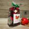 Apple Cinnamon Potpourri by Irish Twins. Bag with red and brown botanicals, a fresh apple, and cinnamon sticks.