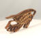 Handcrafted wooden tropical fish ornament made from 1/4-inch thick oak, finished with shellac, designed for holiday decor or year-round display as wall art.
