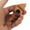 Handcrafted miniature wooden birdhouse ornament shaped like an icecicle with a pointed roof and base, featuring a rounded entrance hole and a perched bird, and made from reclaimed hardwoods finished with a satin shellac.
