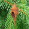 Handcrafted miniature wooden birdhouse ornament shaped like an icecicle with a pointed roof and base, featuring a rounded entrance hole and a perched bird, and made from reclaimed hardwoods finished with a satin shellac.