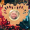 Wooden heart-shaped ornament with scalloped edges and an oak grain finish, featuring a removable round gold frame that holds a photo of a smiling blonde child.