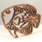 Handcrafted wooden tropical fish ornament made from 1/4-inch thick oak, finished with shellac, designed for holiday decor or year-round display as wall art.