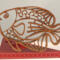 Handcrafted wooden tropical fish ornament made from 1/4-inch thick oak, finished with shellac, designed for holiday decor or year-round display as wall art.